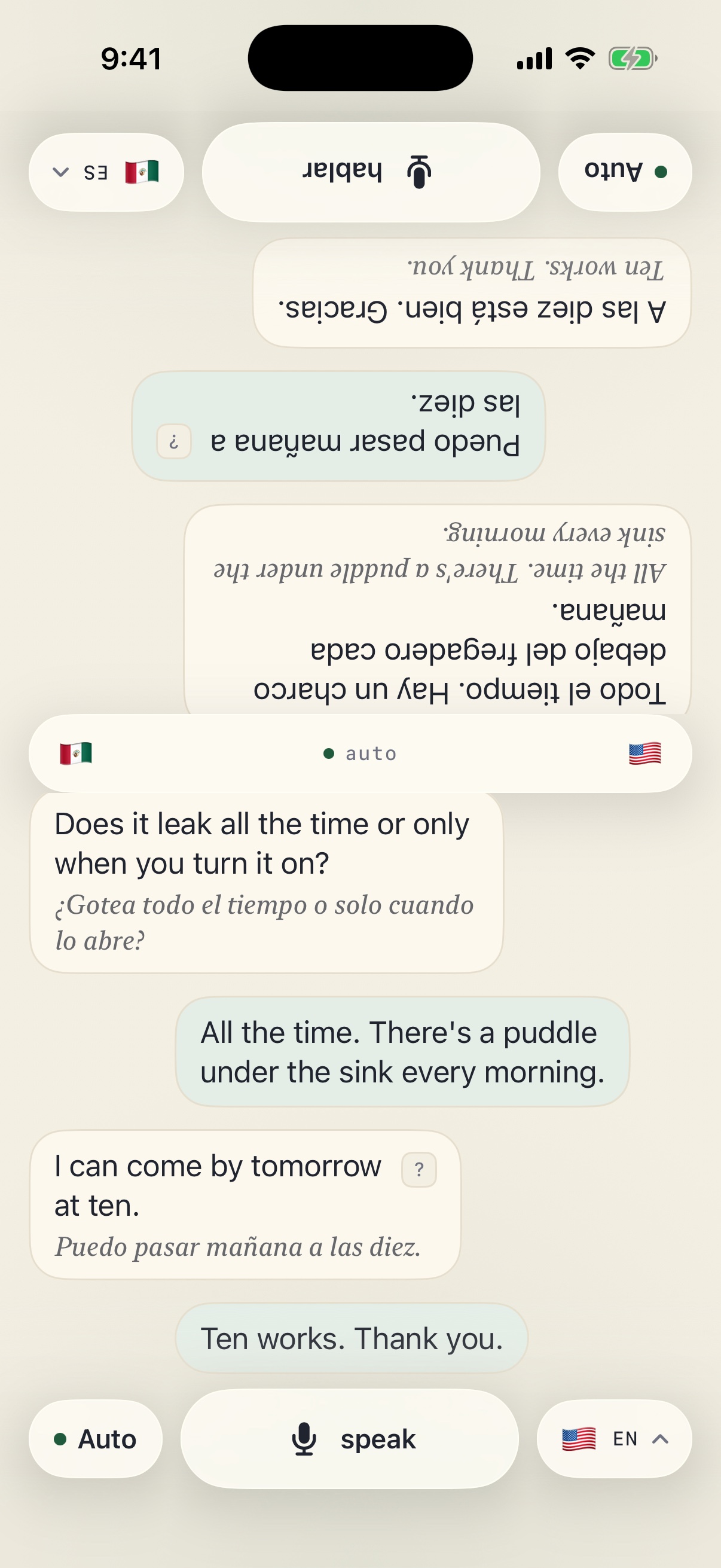 Forte's 2-Way table: one iPhone split in two, the far half rotated to face the other person and set in Spanish, the near half in English, a conversation about a leaking faucet running down both sides